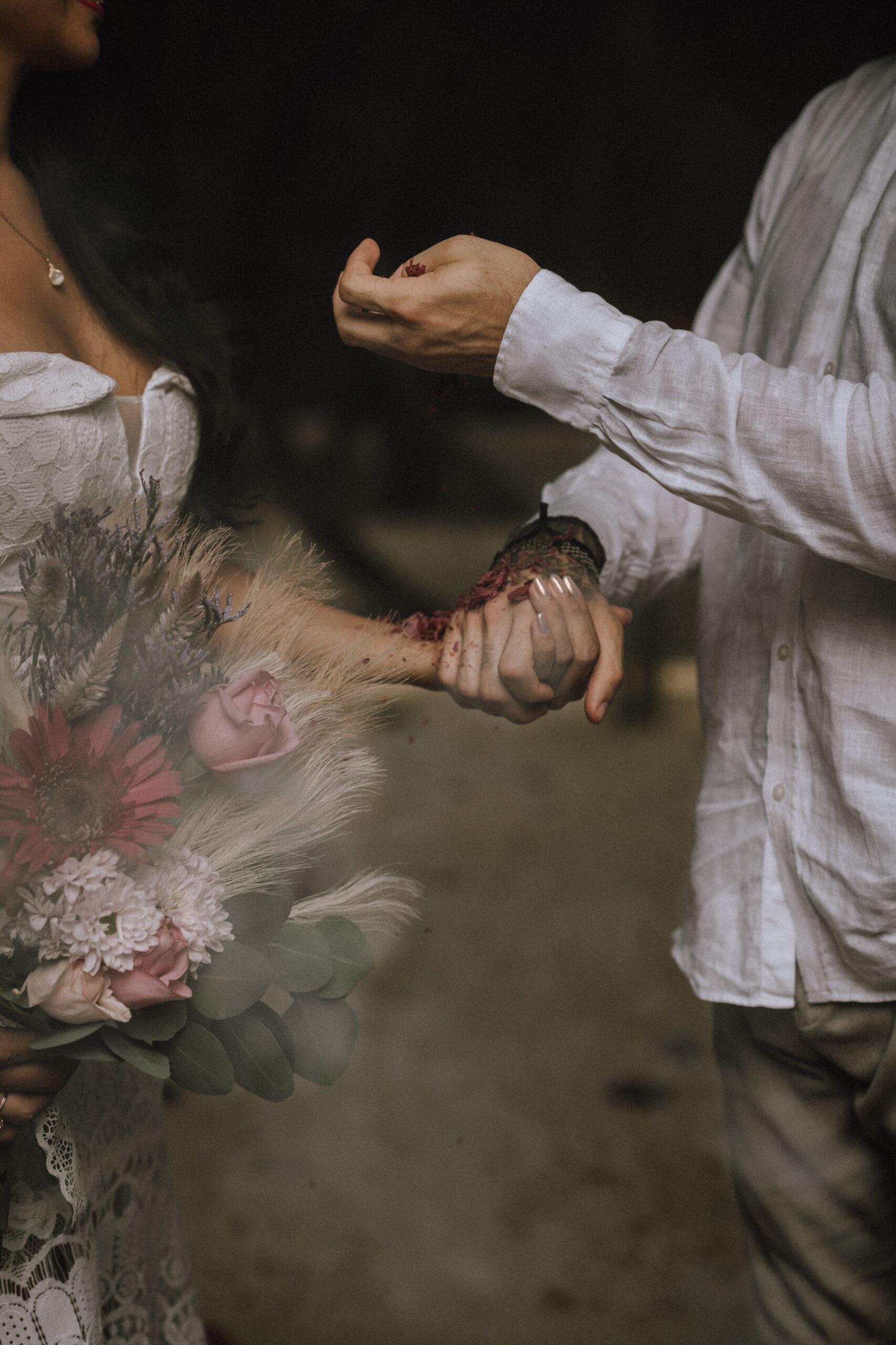 Spiritual Elopement in Tulum, the couple takes part in a petal ceremony, gently showering each other in petals as celebration of their sacred union.