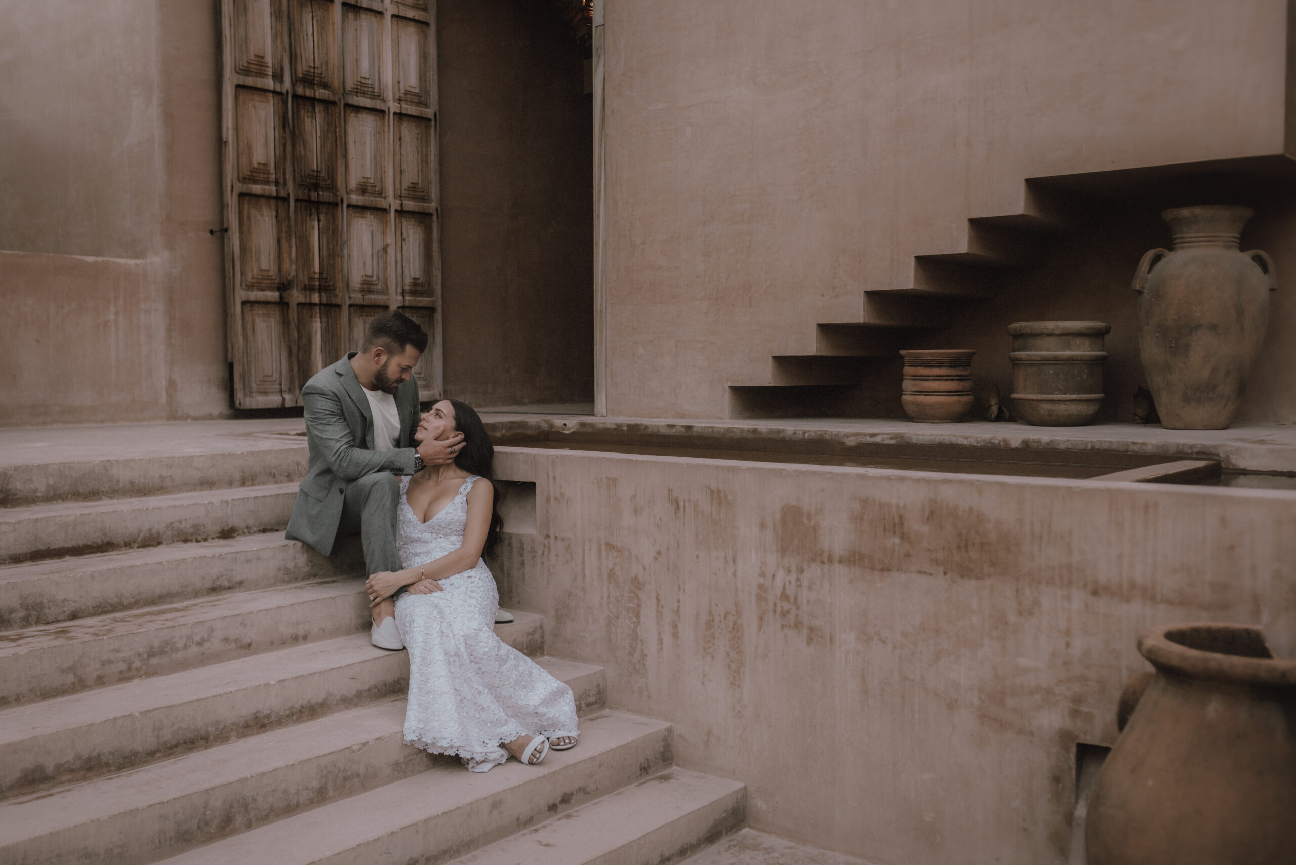 Bride and Groom sit on the staircase at Xela Tulum before their elopement ceremony.