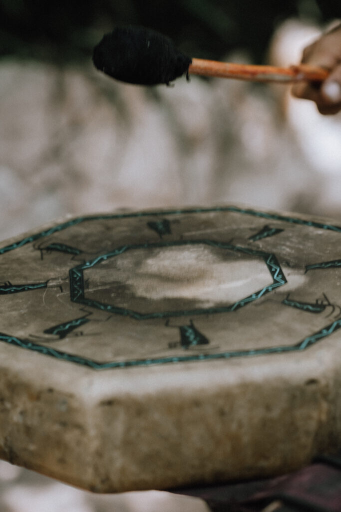 Drum beat is the heartbeat of a ceremony during an elopement at a cenote in Tulum.